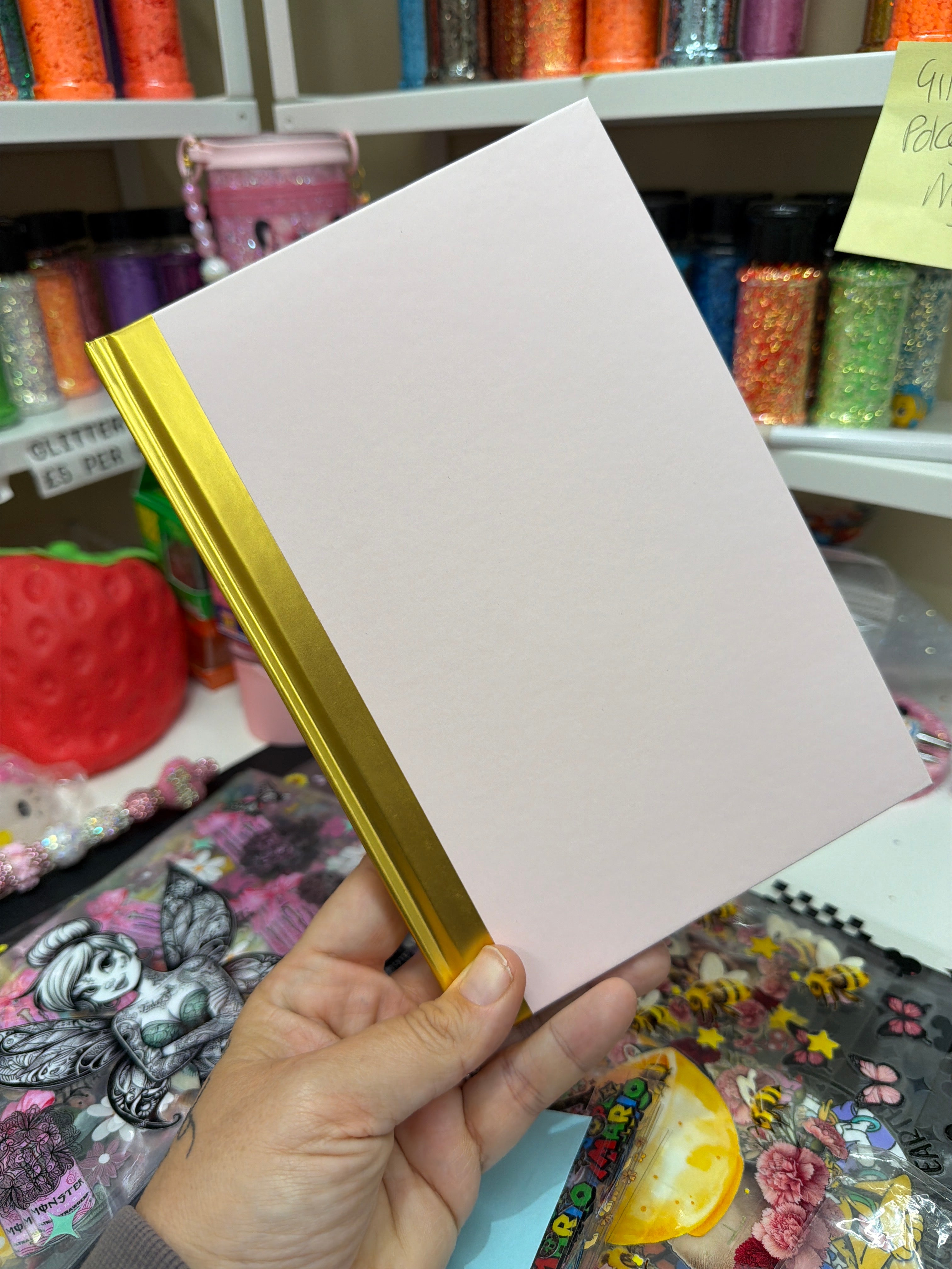 Pink and gold notebooks